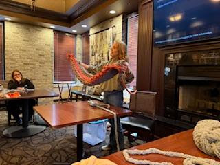 Lady showing how to make blankets