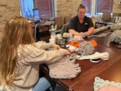 Two ladies working making blankets