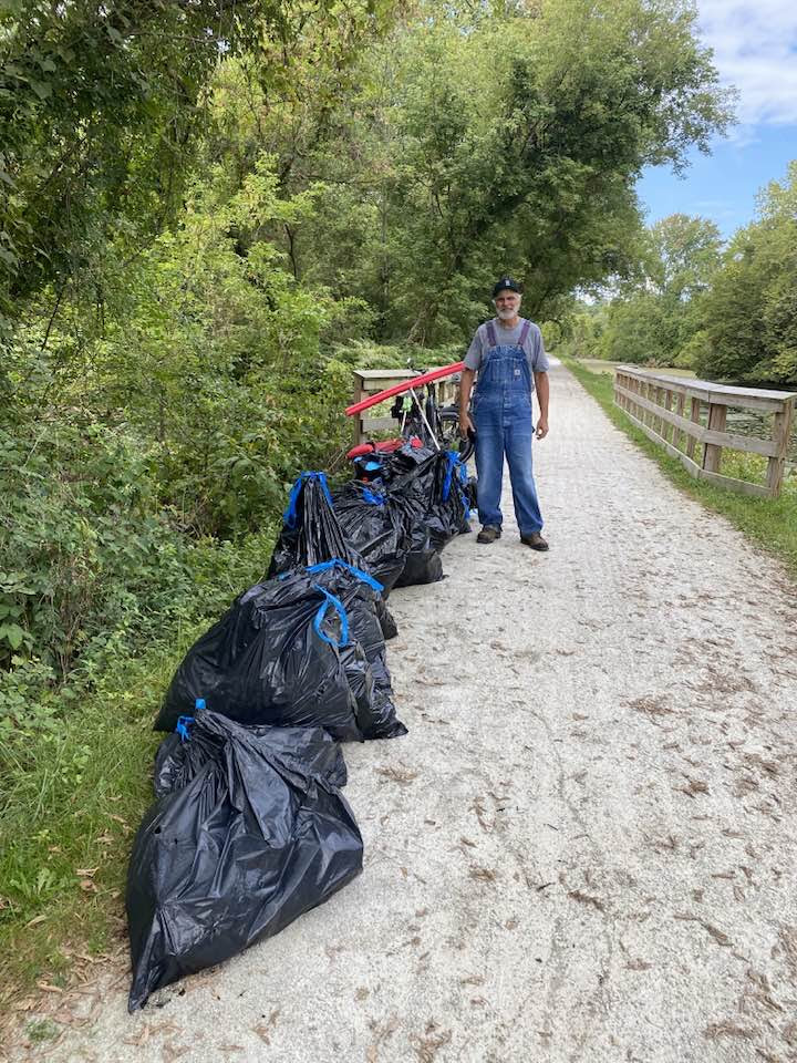 Bags of trash lined up on path